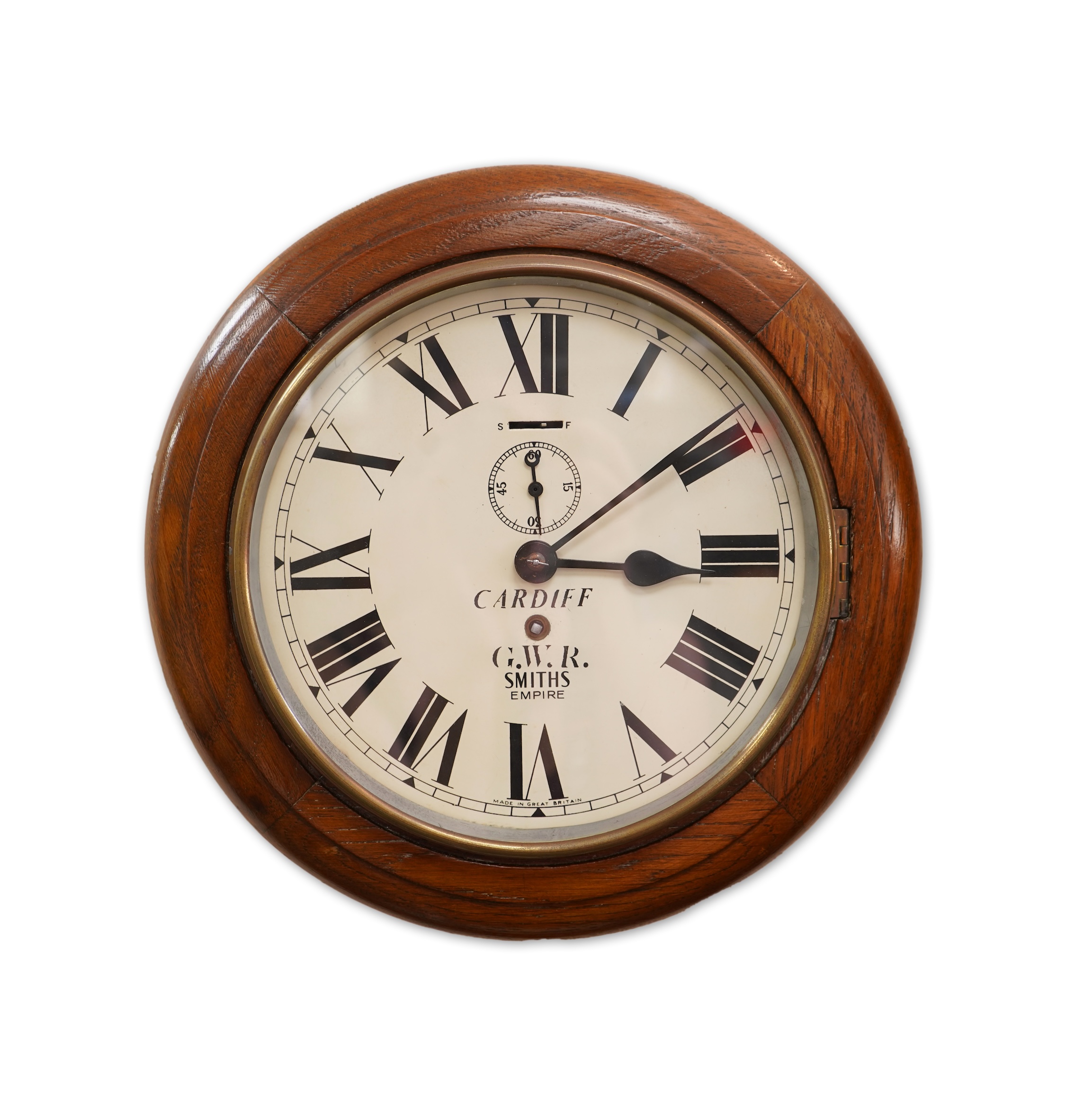 A GWR mahogany wall timepiece by Smiths, Made in Great Britain, with 8” painted dial marked Cardiff and separate seconds dial within the chapter ring, platform escapement, ivorine plaque engraved with ‘BR-WR 3952’ to the
